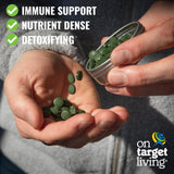 On Target Living Chlorella Spirulina Tablets on a wooden table