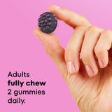 ONE A DAY Prenatal Vitamin Gummies with a measuring spoon