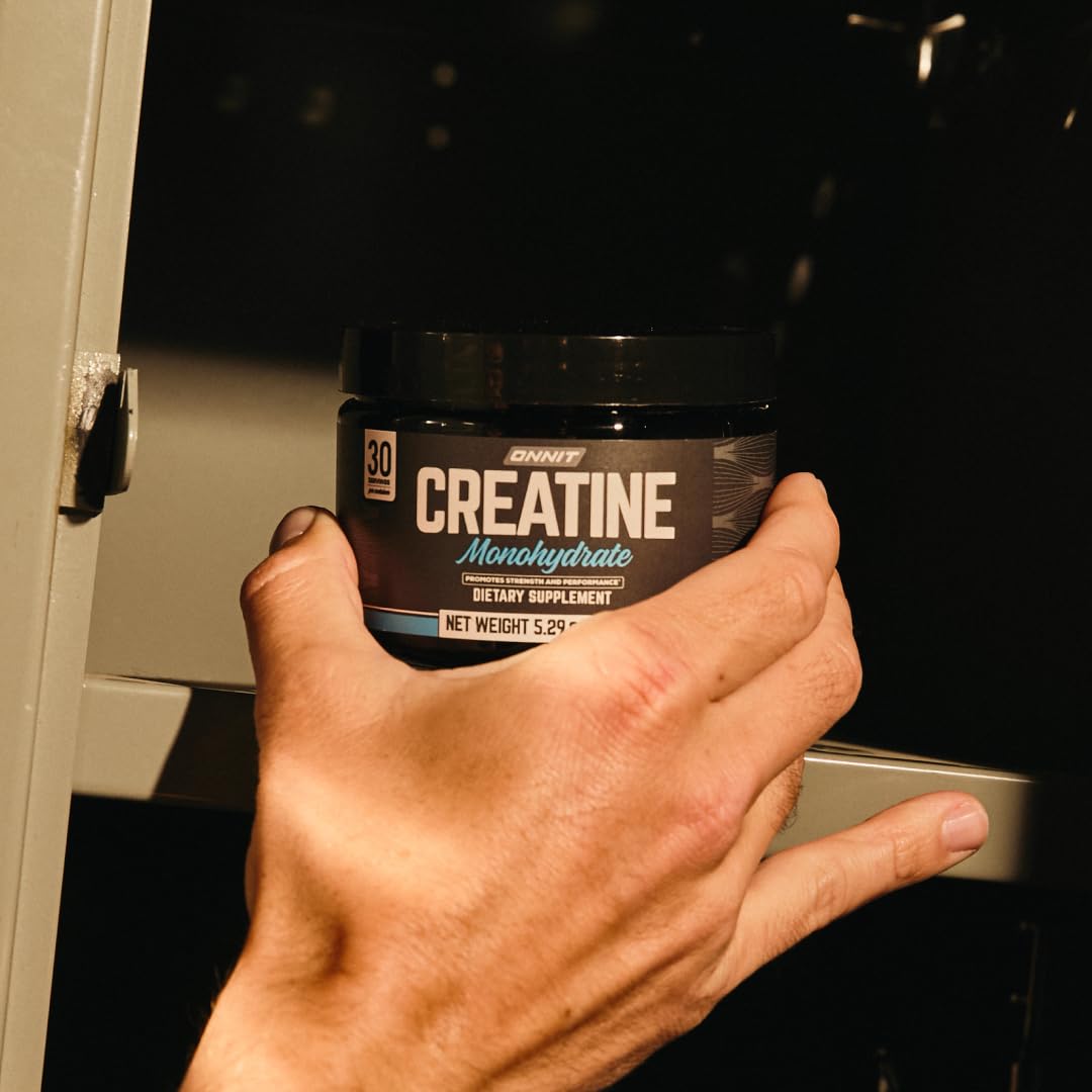ONNIT Creatine Monohydrate Powder with fitness accessories