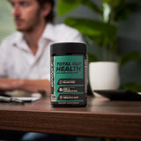 ONNIT Total a daily routine capsules in hand