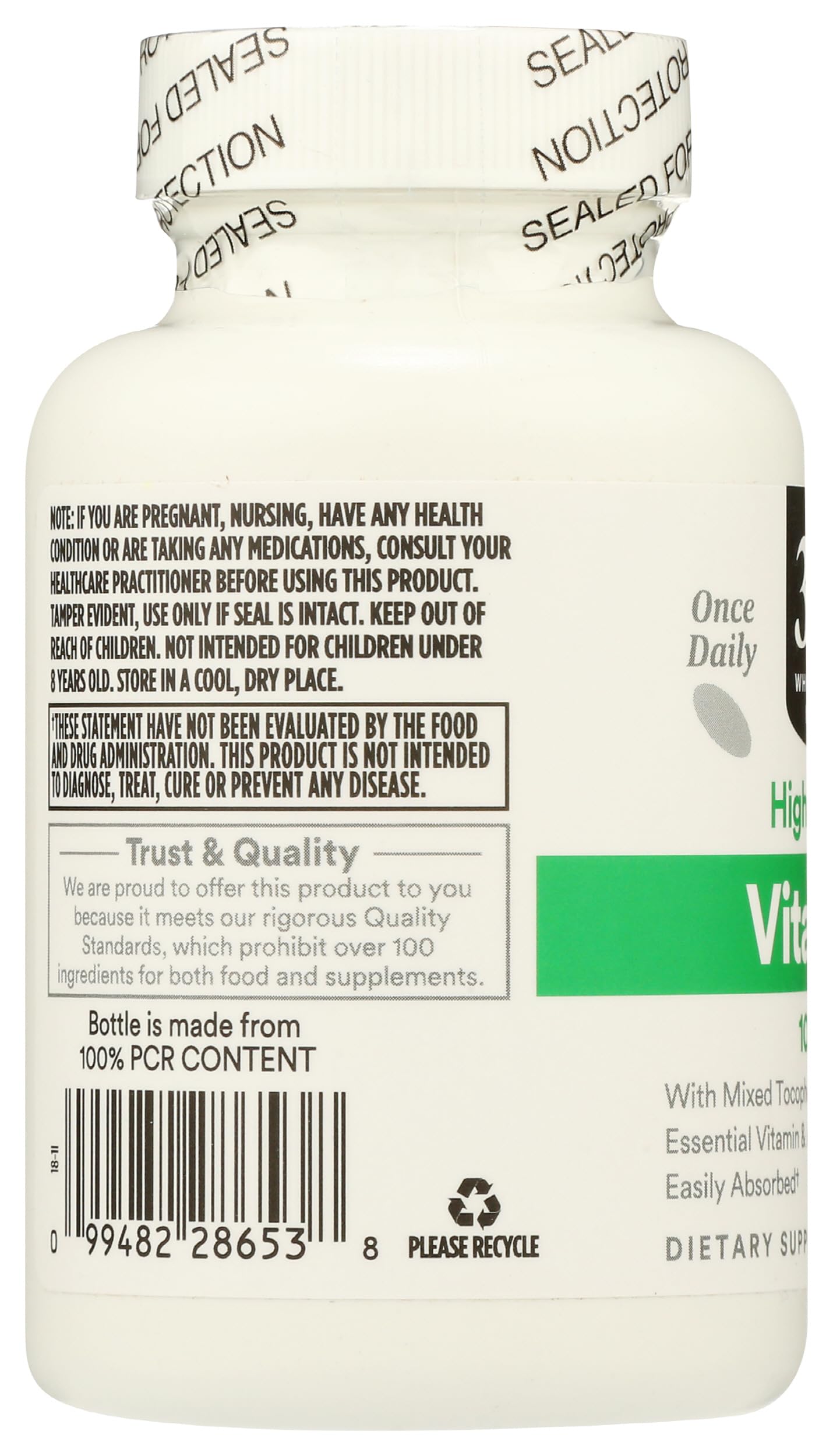 Open bottle of 365 Vitamin E Softgels showing softgels