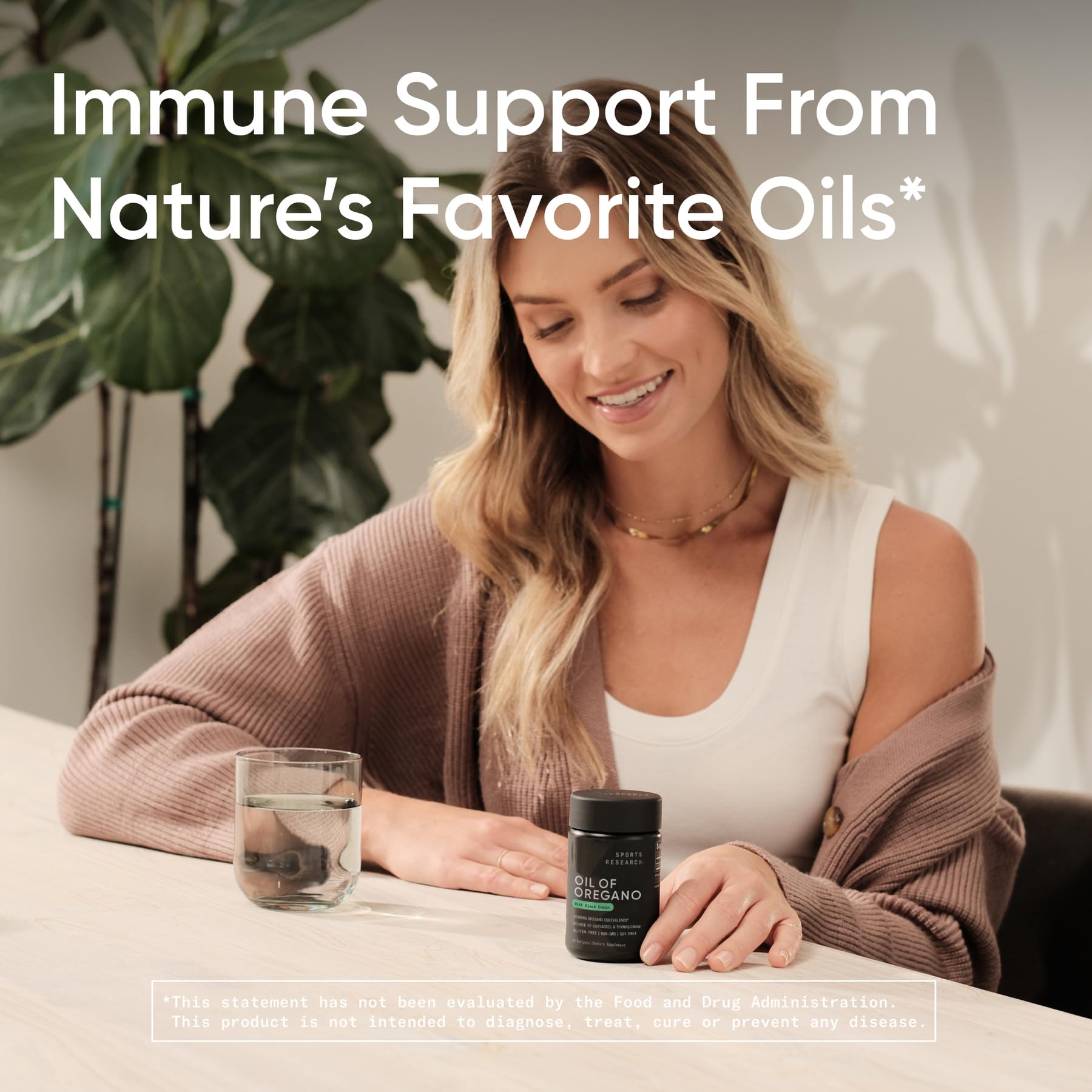 Open bottle of Sports Research Oregano Oil & Black Cumin Seed Oil Softgels with softgels visible