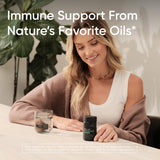 Open bottle of Sports Research Oregano Oil & Black Cumin Seed Oil Softgels with softgels visible