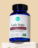 Ora Organic Lady Bugs Prebiotic Capsules in hand