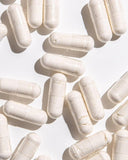 Ora Organic Probiotic Supplement displayed with a plant background