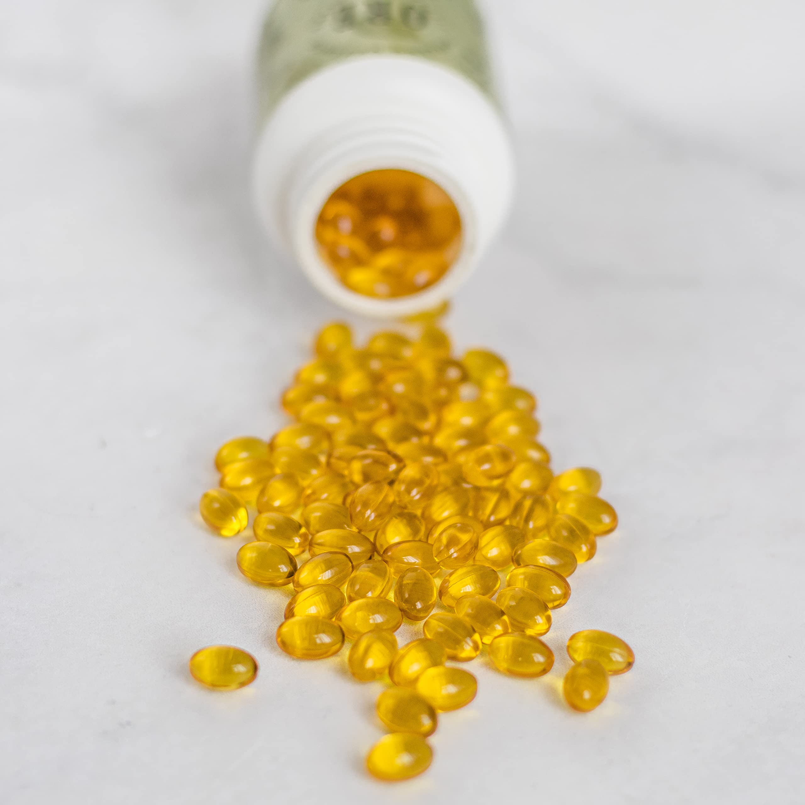 ORE Oregano Oil Softgels with measuring spoon