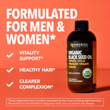 Organic Black Seed Oil in a glass with food