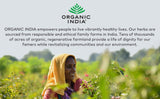 Organic India Triphala Powder with herbs background