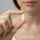 ORZAX Magnesium Triple Complex tablets in a hand