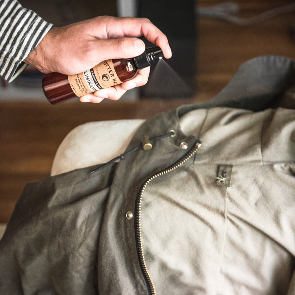 Otter Wax Odour Eliminator Spray 142g in use on a waxed jacket
