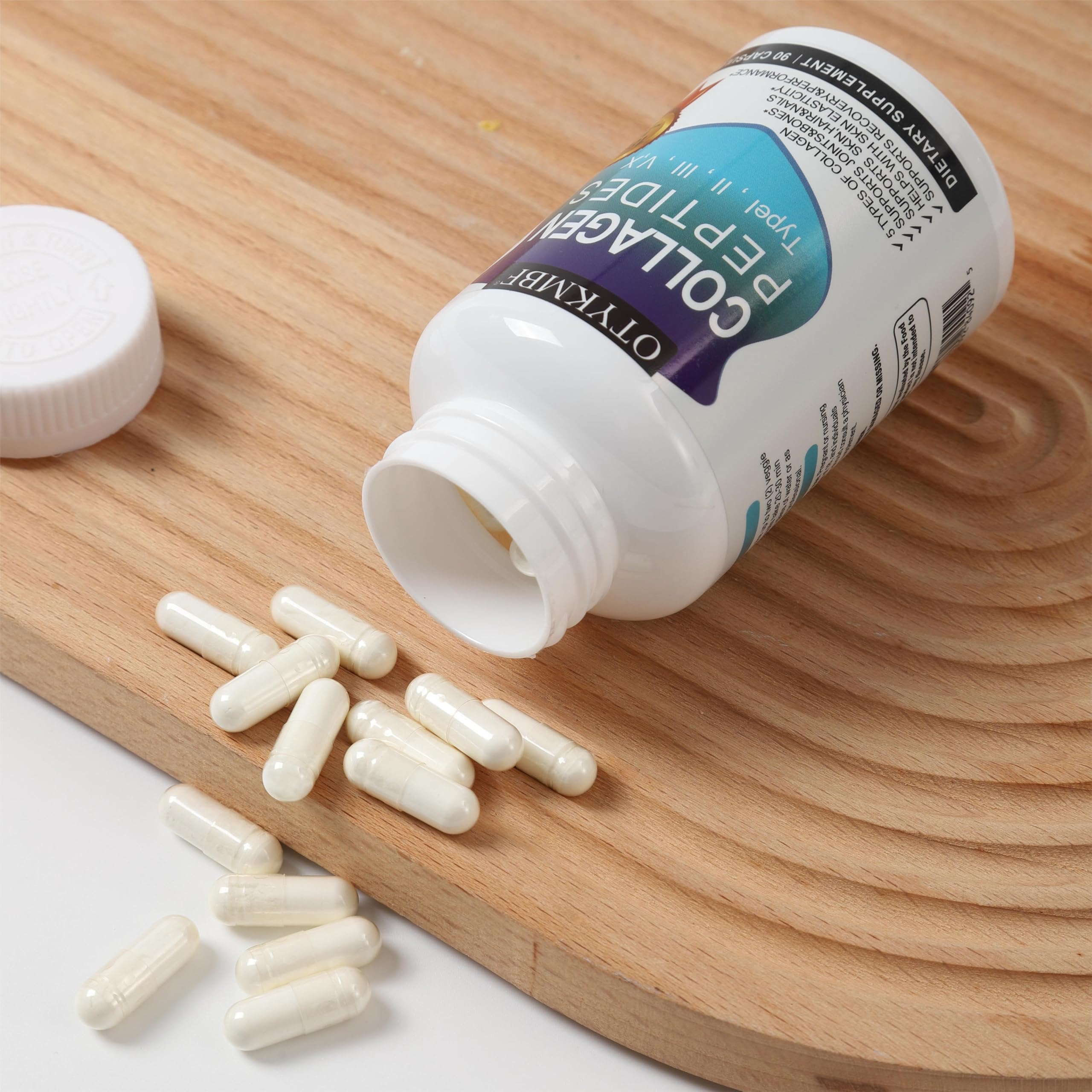 OTYKMBF Collagen Peptides Capsules displayed with other supplements