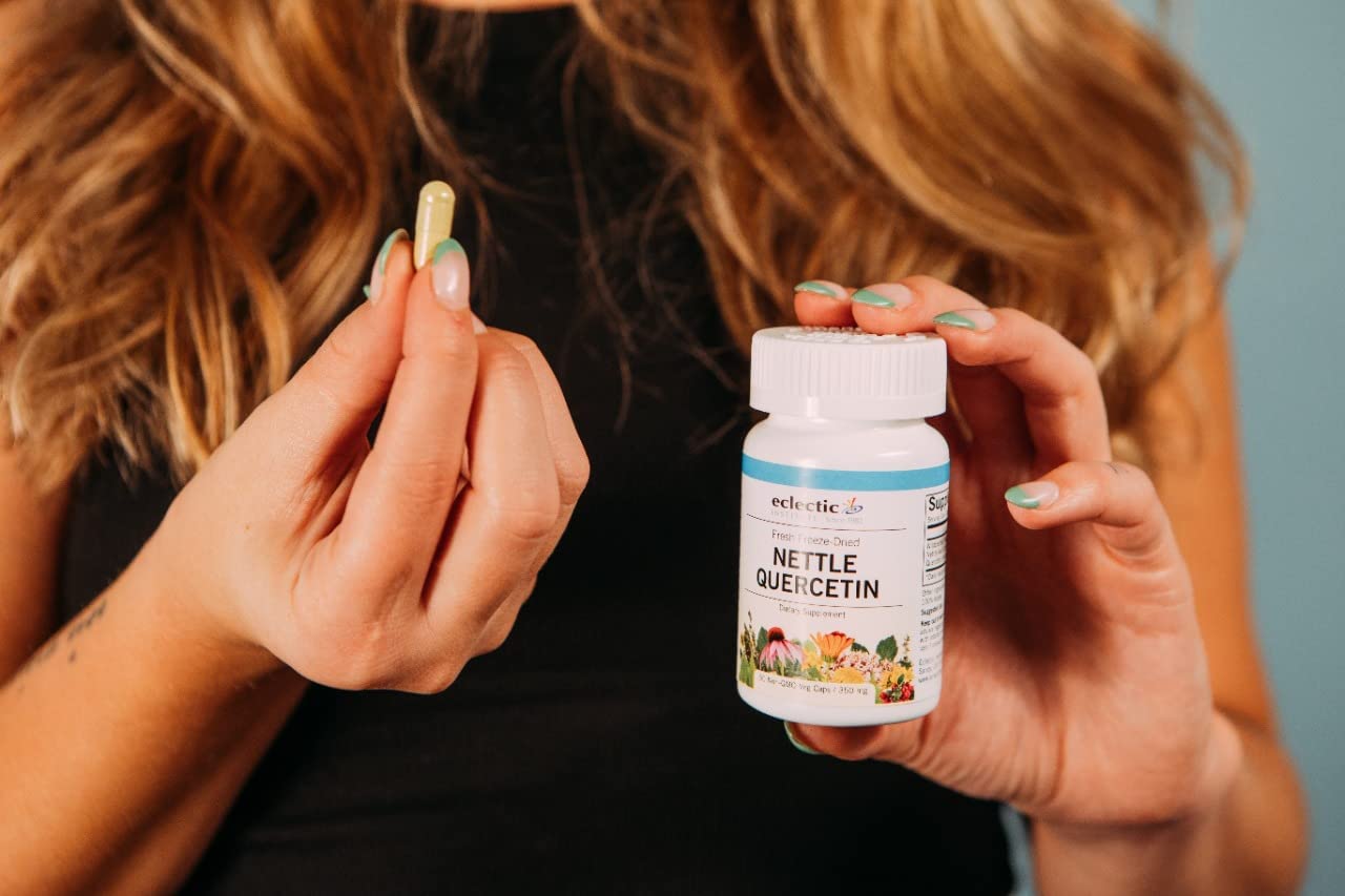 Packaging of Eclectic Stinging Nettle Capsules on a table