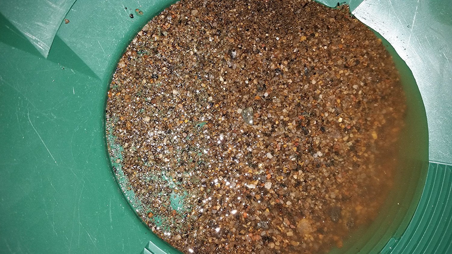 Panning scene with Colorado Gold Paydirt and tools