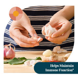 Pattern Wellness Organic Garlic Capsules on a wooden table