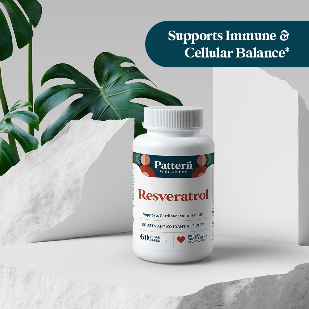 Pattern Wellness Resveratrol supplement capsules in hand
