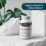 Pattern Wellness Resveratrol supplement capsules in hand