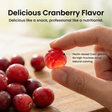 Peehss Cranberry Blend Gummies lifestyle scene with a glass of water