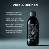 Perfect Press Black Cumin Oil on a wooden table