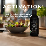 Perfect Press Black Cumin Oil with a measuring spoon