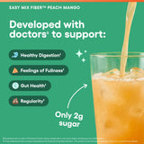 Physician's CHOICE Peach Mango Easy Mix Fiber Powder in a glass of water