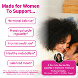 Pink Stork Inositol Supplement capsules on a wooden table