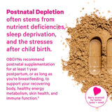 Pink Stork Postpartum Mood Support capsules on a wooden table