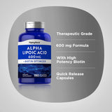 Piping Rock Alpha Lipoic Acid 600mg capsules on a wooden surface