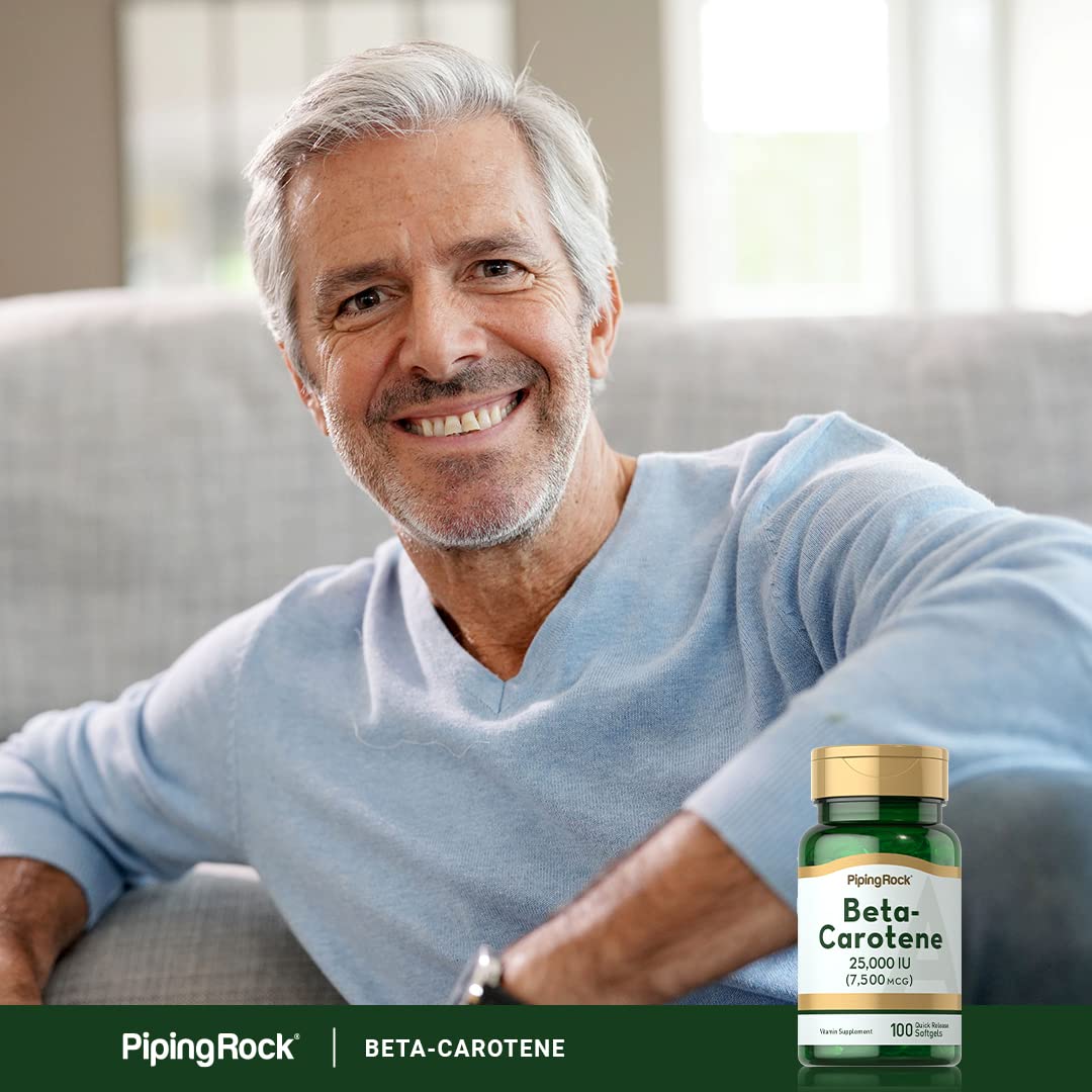 Piping Rock Beta Carotene 25,000 IU softgel capsules in a hand