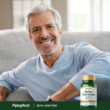 Piping Rock Beta Carotene 25,000 IU softgel capsules in a hand