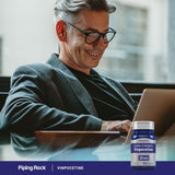 Piping Rock Blended Vitamin & Mineral Supplement on a wooden table