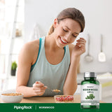 Piping Rock Blended Vitamin & Mineral Supplement on a wooden table