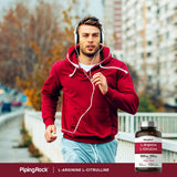 Piping Rock L-Arginine 159g with a green plant background