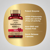 Piping Rock Multi-Enzymes Nattokinase 100mg capsules on a wooden surface