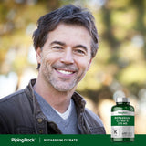 Piping Rock Potassium Citrate capsules in a hand