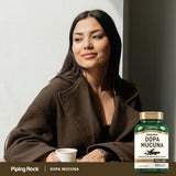 Piping Rock Velvet Bean Extract 15% L-DOPA capsules with a glass of water