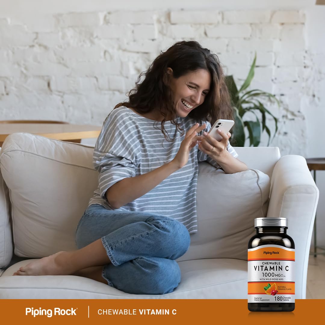 Piping Rock Vitamin C 395g supplement with a glass of water