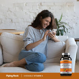 Piping Rock Vitamin C 395g supplement with a glass of water