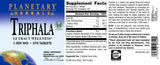Planetary Herbals Triphala 386g supplement in a lifestyle setting