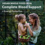 PlantFusion Vegan Iron Supplement capsules on a wooden table