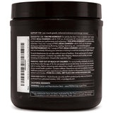 PMD BCAA Powder displayed with fitness equipment