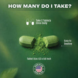 Pomona Wellness Organic Greens Powder Supplement tablet on a wooden surface