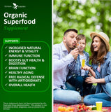 Potent Garden Super Greens Capsules displayed with organic fruits and vegetables