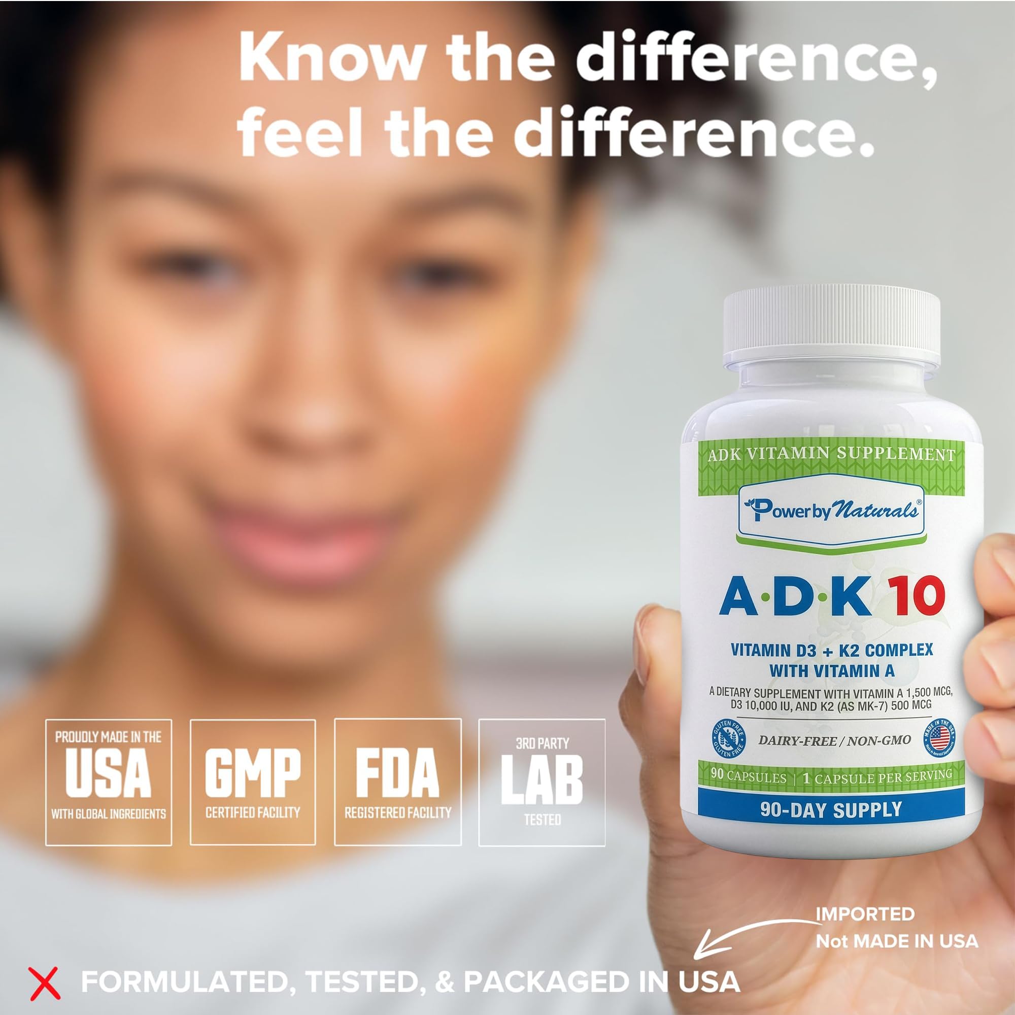 Power By Naturals ADK 10 supplement bottle with vitamins on a marble surface