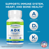 Power By Naturals ADK Supplement with a glass of water