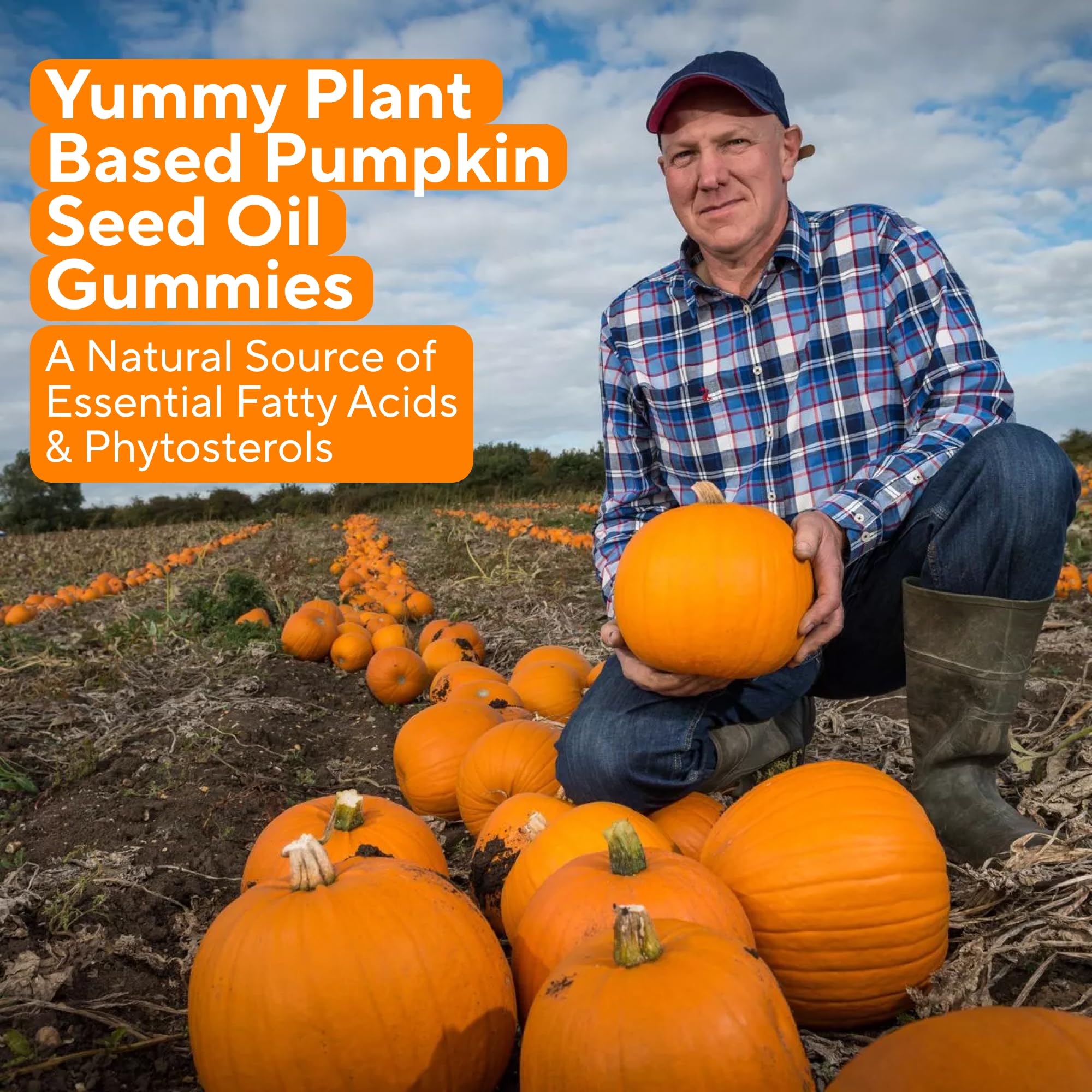 Power Grain Pumpkin Seed Oil Gummies on a wooden table with fresh oranges
