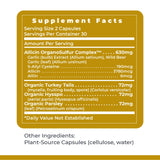 Premier Research Labs Allicidin Garlic Supplement on a wooden table