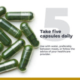 Premier Research Labs Super Greens Supplement 100g capsules on a wooden table