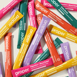 Proper 5-pack blended supplements sticks in a lifestyle setting
