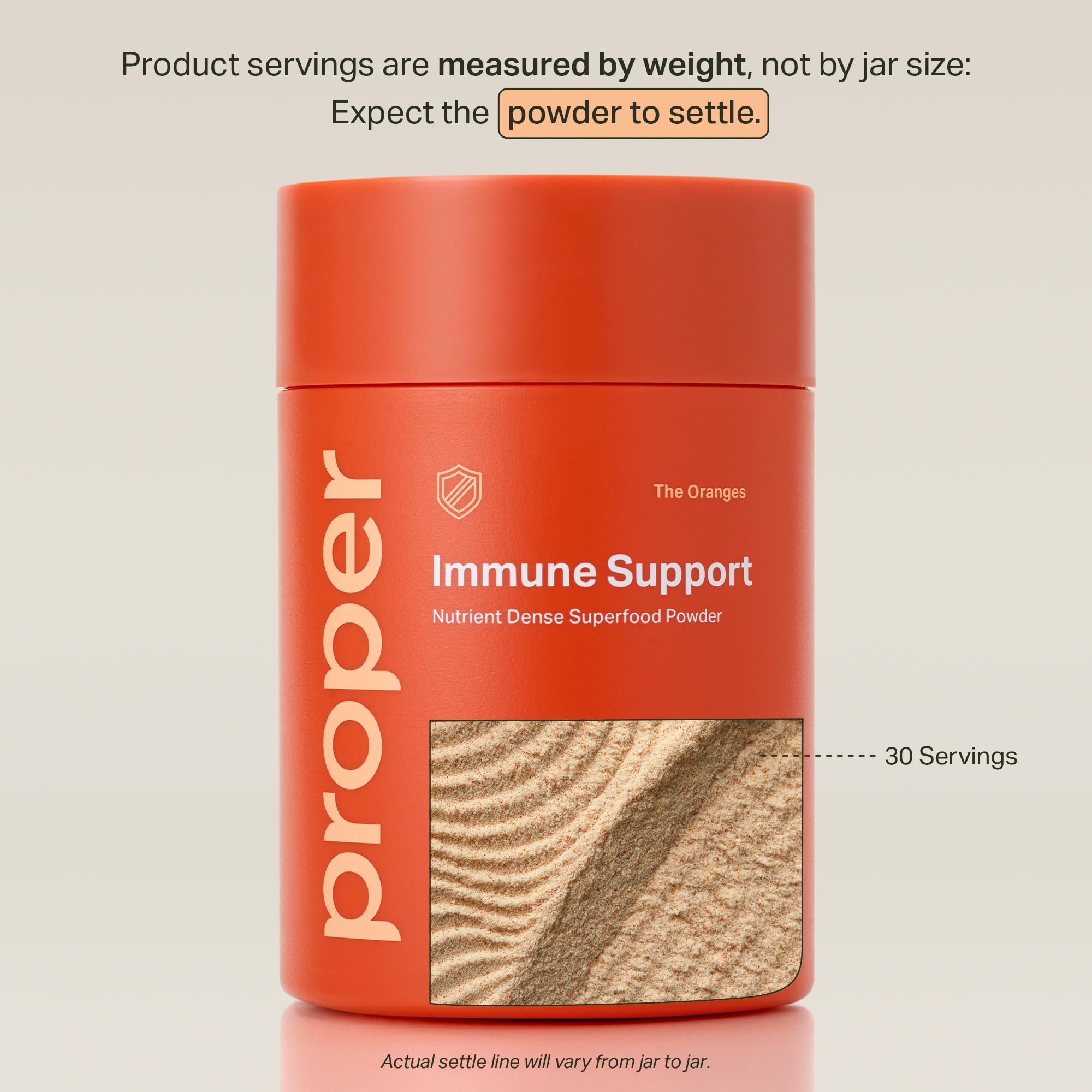 Proper Vitamin C Powder scoop showing orange tangerine powder