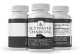 PURE Activated Charcoal Capsules on a wooden surface